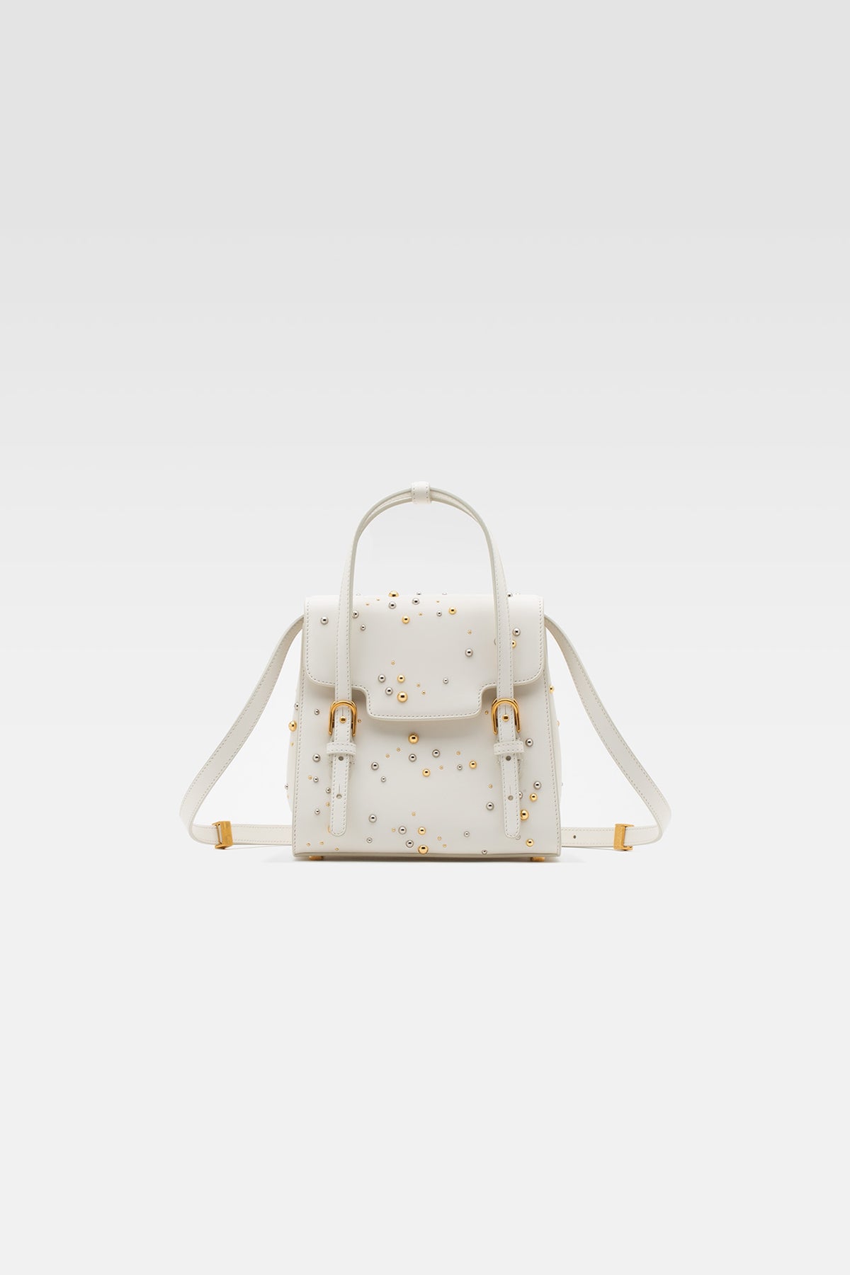 Flap bag in leather color milk with studs