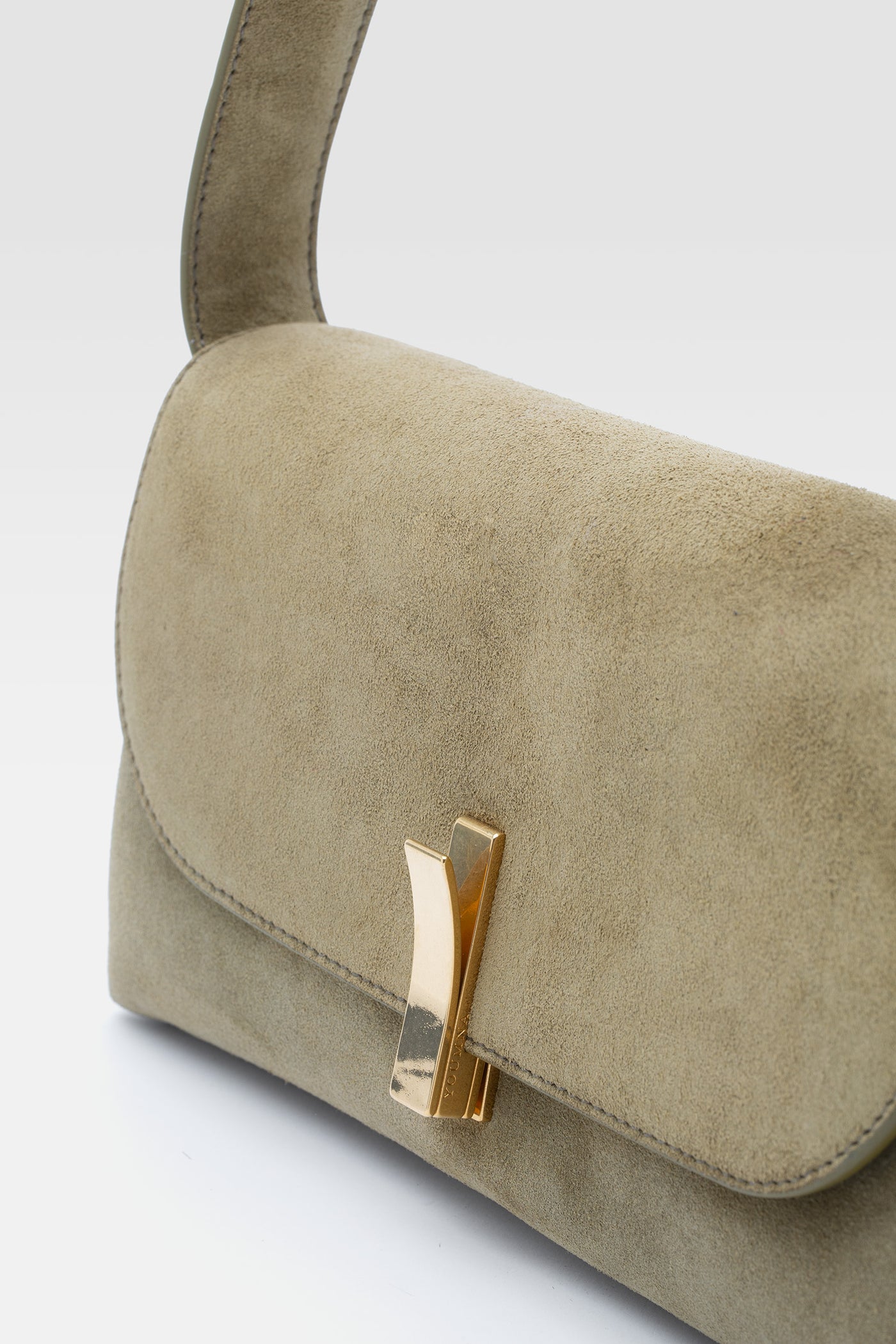 Green suede pouch bag in military green.