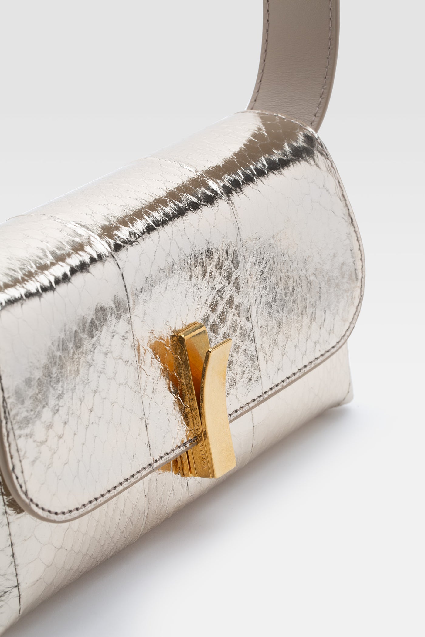 Mini shoulder bag in simil snake leather in taupe color. 